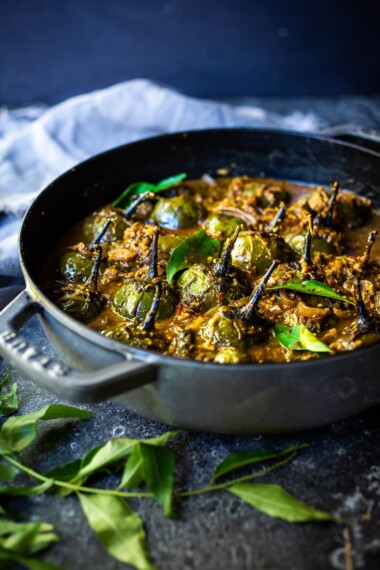 A flavorful recipe for Brinjal Curry (Indian Eggplant) gently simmered in a fragrant Masala Sauce. Serve with Indian-style Basmati Rice and naan bread for a delicious vegetarian or vegan meal. #brinjal #curryeggplant #indianeggplant #brinjalcurry