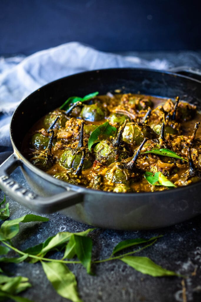 A flavorful recipe for Brinjal Curry (Indian Eggplant) gently simmered in a fragrant Masala Sauce. Serve with Indian-style Basmati Rice and naan bread for a delicious vegetarian or vegan meal. #brinjal #curryeggplant #indianeggplant #brinjalcurry