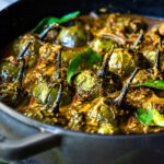 A flavorful recipe for Brinjal Curry (Indian Eggplant) gently simmered in a fragrant Masala Sauce. Serve with Indian-style Basmati Rice and naan bread for a delicious vegetarian or vegan meal. #brinjal #curryeggplant #indianeggplant #brinjalcurry
