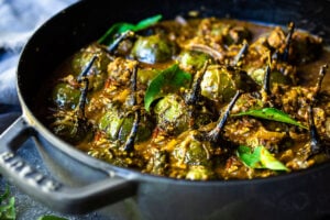 A flavorful recipe for Brinjal Curry (Indian Eggplant) gently simmered in a fragrant Masala Sauce. Serve with Indian-style Basmati Rice and naan bread for a delicious vegetarian or vegan meal. #brinjal #curryeggplant #indianeggplant #brinjalcurry