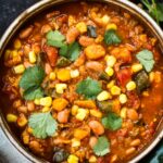 Instant Pot Pinto Bean Stew using dry beans with corn, yams, and poblanos. A vegan-adaptable soup that only takes 15 minutes of hands-on time. #instantpotrecipe, #vegansoup #veganstew #pintobeanstew