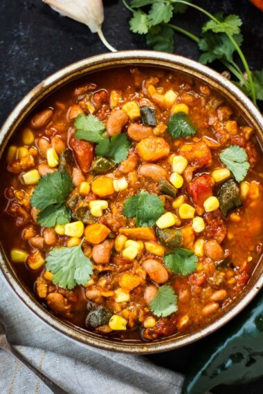 Instant Pot Pinto Bean Stew using dry beans with corn, yams, and poblanos. A vegan-adaptable soup that only takes 15 minutes of hands-on time. #instantpotrecipe, #vegansoup #veganstew #pintobeanstew