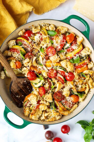 A simple recipe for Zucchini Gratin with tomatoes, breadcrumbs, garlic parmesan, and fresh basil. A quick and easy vegetarian side dish that's cozy and warming.