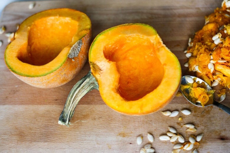 Scooping the seeds out of the pumpkin.