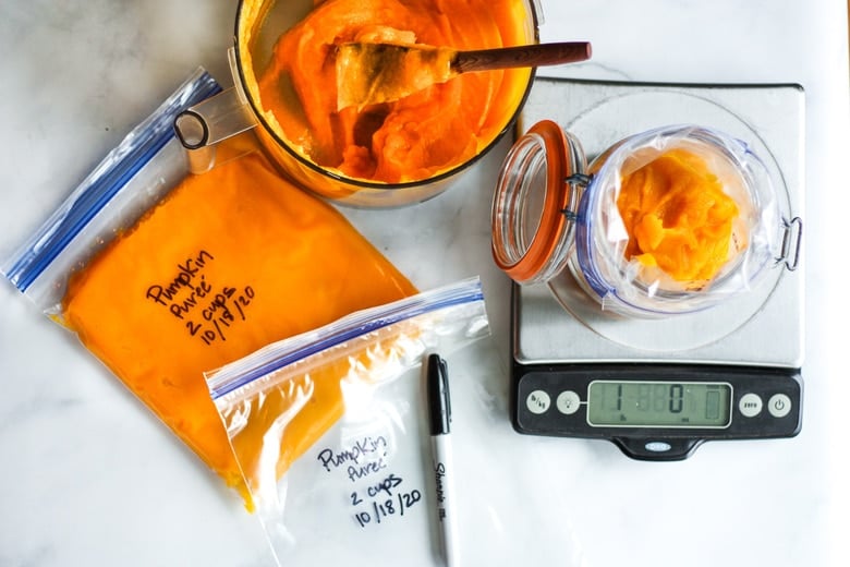 How to make homemade Pumpkin Puree from scratch- a simple easy step-by-step recipe to use in place of canned pumpkin. Learn how to roast pumpkin, puree pumpkin and store it for future use, all in about an hour! #pumpkinpuree #roastedpumpkin