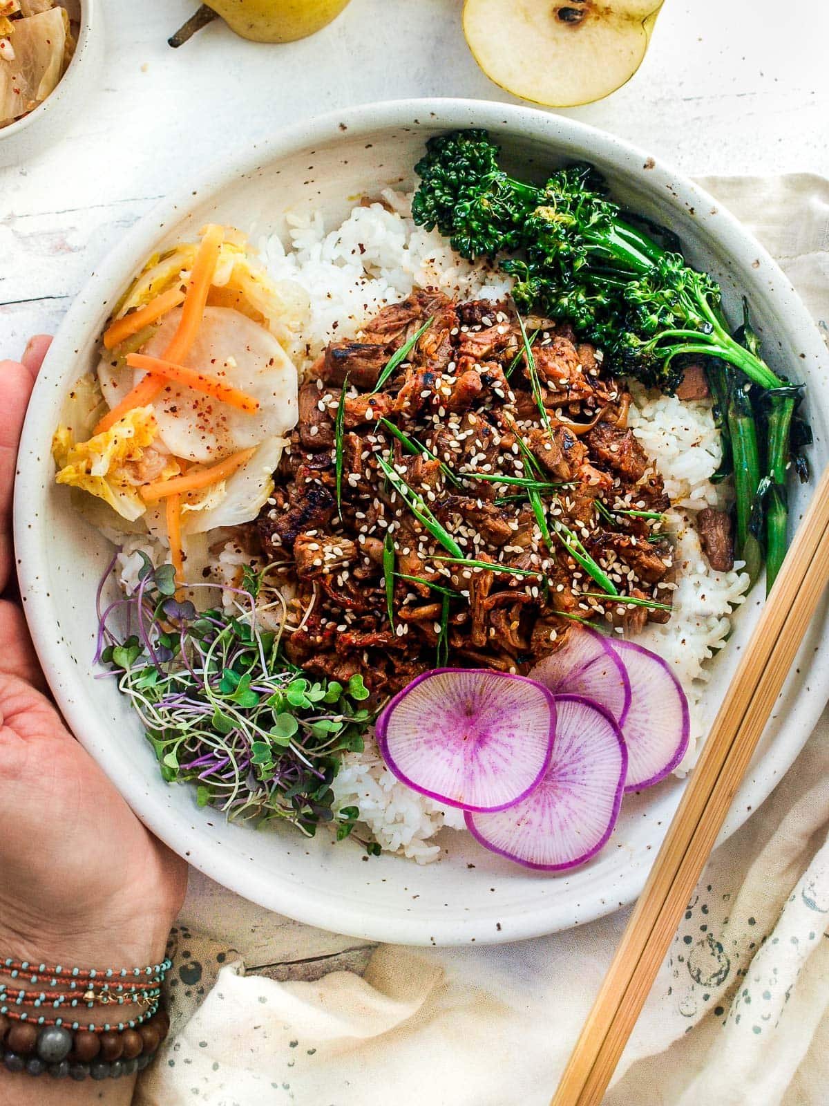 Delicious vegan bulgogi recipe ready in minutes! Jackfruit soaks up all the yummy flavors instantly without hours of marinating. Pair with jasmine rice, kimchi, and seared vegetables for a quick and excellent dinner. Vegan and gluten-free. 
