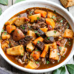 Get warm and cozy with this Instant Pot Beef Stew with Root Veggies- a hearty, comforting one-pot meal made in the pressure cooker, that is keto friendly, easy to make and full of depth and flavor. #beefstew #instantpotbeefstew #instantpot #bestbeefstew
