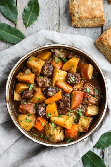 Get warm and cozy with this Instant Pot Beef Stew with Root Veggies- a hearty, comforting one-pot meal made in the pressure cooker, that is keto friendly, easy to make and full of depth and flavor. #beefstew #instantpotbeefstew #instantpot #bestbeefstew