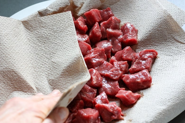 patting dry the stew meat