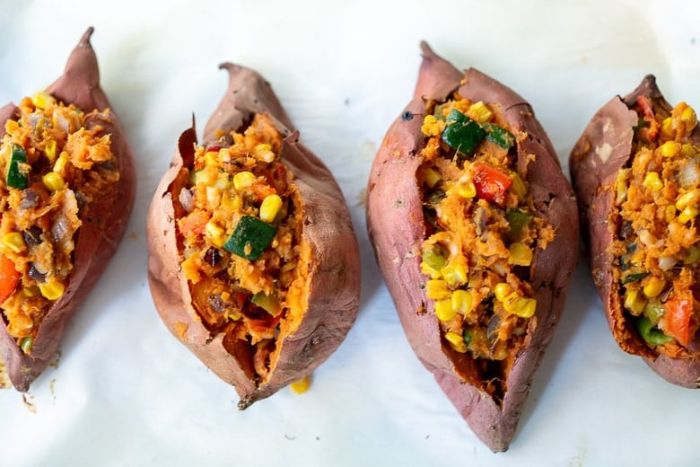 These Oaxacan-Style Baked Sweet Potatoes are loaded up with healthy veggies and infused with Oaxacan flavors, served up over optional 5-Minute Mole Sauce. Healthy, flavorful and perfect for Sunday meal prep to reheat during the busy week. Vegan-adaptable! Gluten-free. 