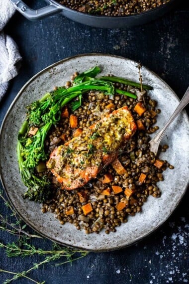Roasted Salmon with Lemon and Thyme served over Braised French Green Lentils- a simple healthy weeknight dinner recipe! #lentils #salmon #bakedsalmon #frenchlemons