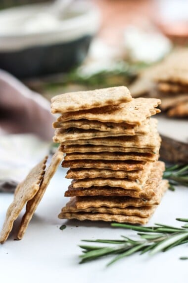 How to make homemade crackers from sourdough discard or starter.  A quick, easy and adaptable recipe.  These crackers are crisp, tangy and incredibly addicting! #sourdough #discard #crackers #crackersrecipe