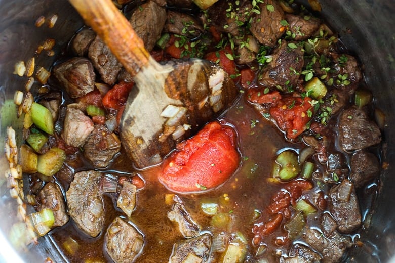 Get warm and cozy with this Instant Pot Beef Stew with Root Veggies- a hearty, comforting one-pot meal made in the pressure cooker, that is keto friendly, easy to make and full of depth and flavor. #beefstew #instantpotbeefstew #instantpot #bestbeefstew