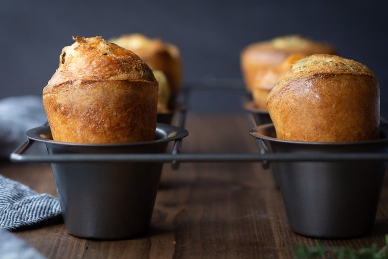 How to make the best Popovers from scratch that are light and airy on the inside and golden and crispy on the outside. An easy recipe that requires only 15 minutes of hands-on time! #popovers