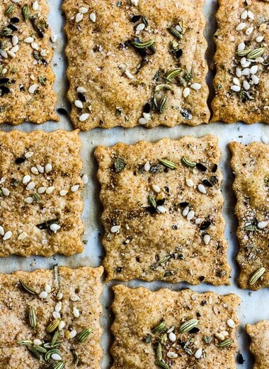 How to make homemade crackers from sourdough discard or starter.  A quick, easy and adaptable recipe.  These crackers are crisp, tangy and incredibly addicting! #sourdough #discard #crackers #crackersrecipe