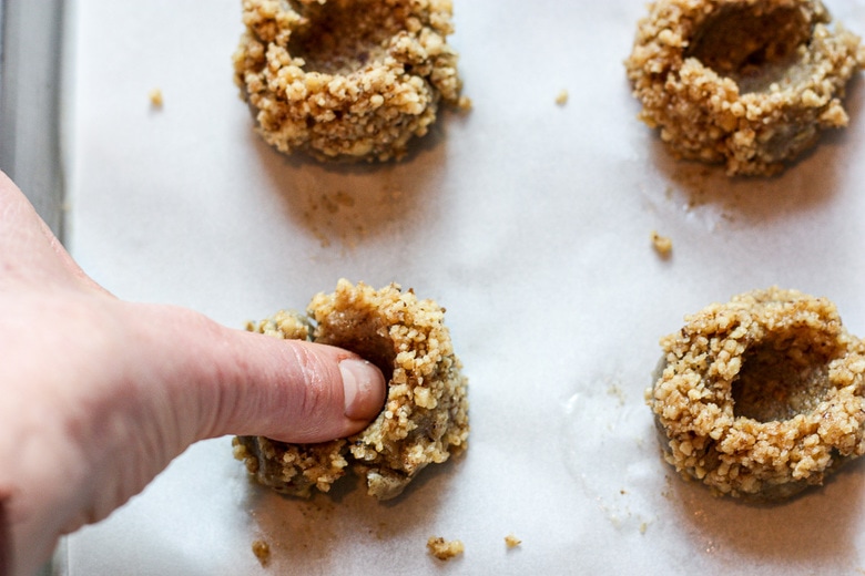 making the thumbprint in the dough