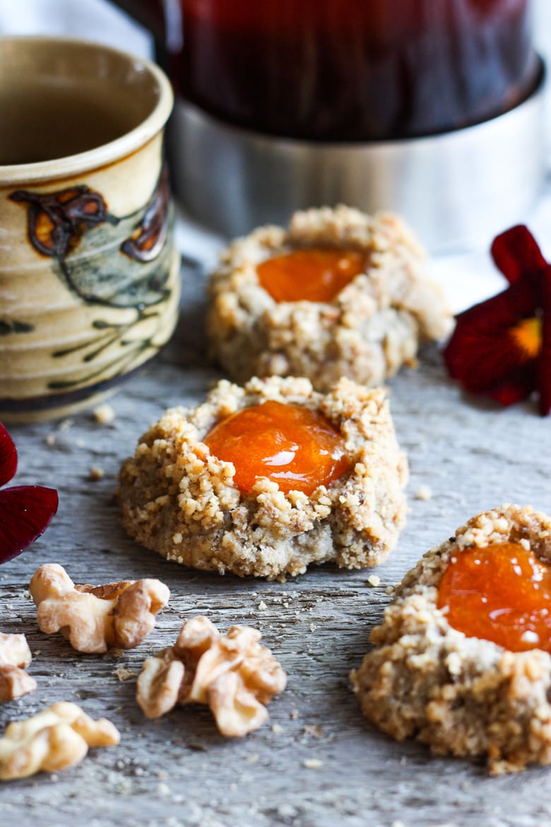 Thumbprint Cookies are a perfect treat for the holidays.  A melt in your mouth rustic thumbprint cookie with rye, toasty walnuts, cardamom and tangy apricot jam-  a perfect balance of flavors, decadent and lightly sweet with a satisfying crunch. #thumbprintcookies