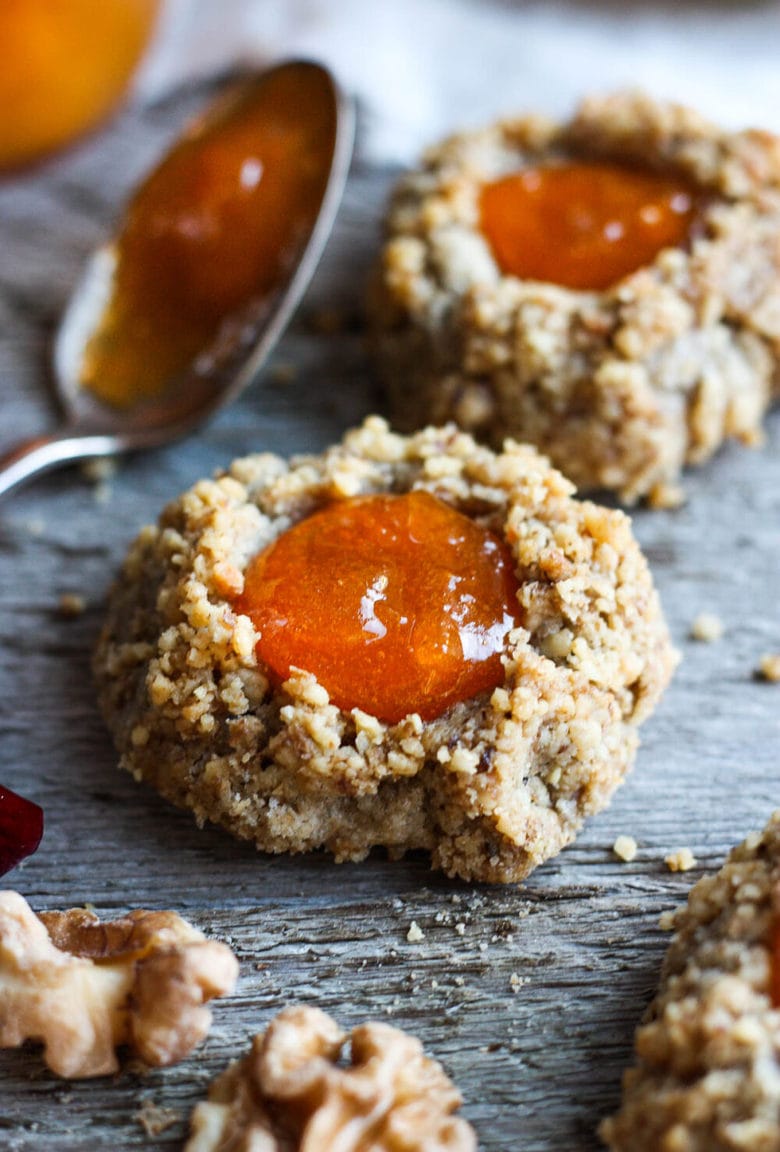 Thumbprint Cookies are a perfect treat for the holidays.  A melt in your mouth rustic thumbprint cookie with rye, toasty walnuts, cardamom and tangy apricot jam-  a perfect balance of flavors, decadent and lightly sweet with a satisfying crunch. #thumbprintcookies