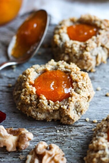 Thumbprint Cookies are a perfect treat for the holidays.  A melt in your mouth rustic thumbprint cookie with rye, toasty walnuts, cardamom and tangy apricot jam-  a perfect balance of flavors, decadent and lightly sweet with a satisfying crunch. #thumbprintcookies