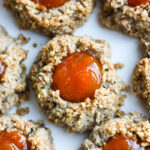 Thumbprint Cookies are a perfect treat for the holidays.  A melt in your mouth rustic thumbprint cookie with rye, toasty walnuts, cardamom and tangy apricot jam-  a perfect balance of flavors, decadent and lightly sweet with a satisfying crunch. #thumbprintcookies