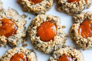 Thumbprint Cookies are a perfect treat for the holidays.  A melt in your mouth rustic thumbprint cookie with rye, toasty walnuts, cardamom and tangy apricot jam-  a perfect balance of flavors, decadent and lightly sweet with a satisfying crunch. #thumbprintcookies