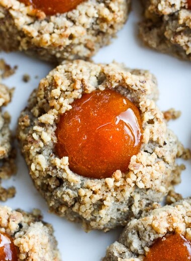 Thumbprint Cookies are a perfect treat for the holidays.  A melt in your mouth rustic thumbprint cookie with rye, toasty walnuts, cardamom and tangy apricot jam-  a perfect balance of flavors, decadent and lightly sweet with a satisfying crunch. #thumbprintcookies