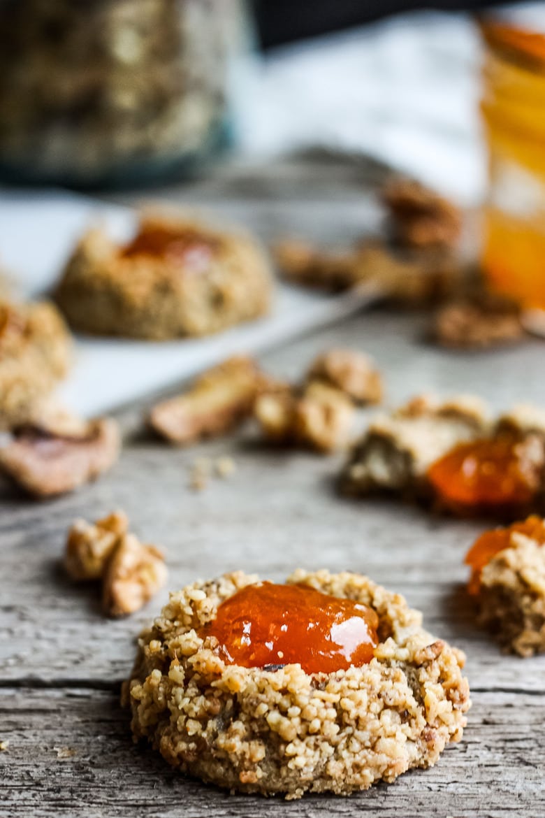 Thumbprint Cookies are a perfect treat for the holidays.  A melt in your mouth rustic thumbprint cookie with rye, toasty walnuts, cardamom and tangy apricot jam-  a perfect balance of flavors, decadent and lightly sweet with a satisfying crunch. #thumbprintcookies