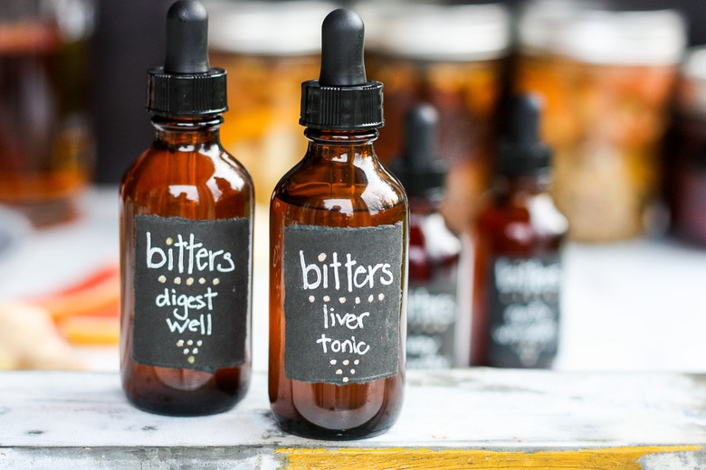 How to make Digestive bitters and Liver Tonic.  An important health tonic that can boost digestion, balance liver health and so much more.  Bitters add beautiful interest and depth to drinks and cocktails. A fun and easy project that takes very little hands-on time! Perfect for holiday gifts and stocking stuffers.