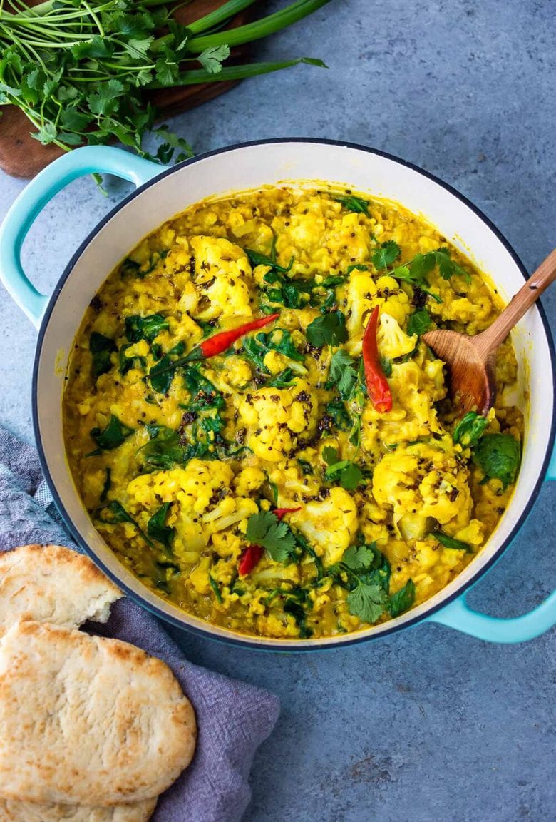 Cauliflower Dal with Coconut and Spinach made with split red lentils and fragrant Indian spices. A healthy comforting, plant-based dinner recipe. Vegan-adaptable. #dal #cauliflower #dalrecipe #lentils