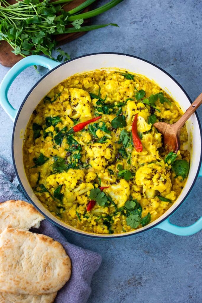 Cauliflower Dal with Coconut and Spinach made with split red lentils and fragrant Indian spices. A healthy comforting, plant-based dinner recipe. Vegan-adaptable. #dal #cauliflower #dalrecipe #lentils