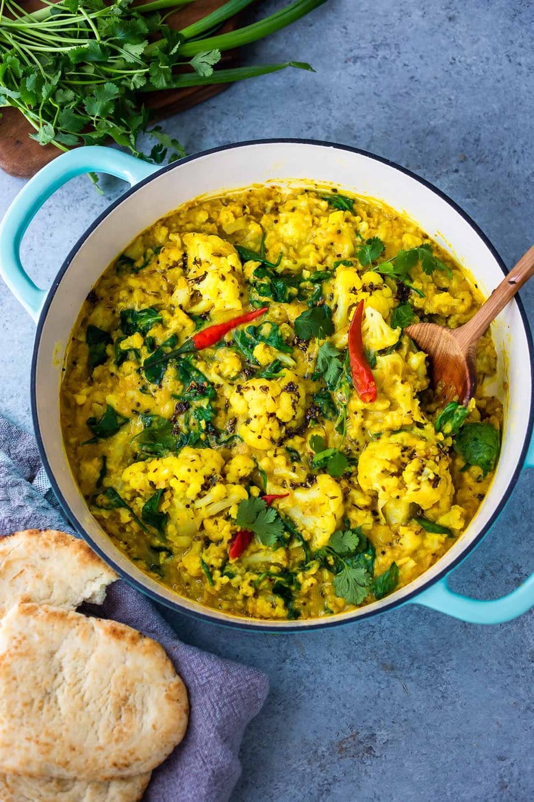 Cauliflower Dal with Coconut and Spinach made with split red lentils and fragrant Indian spices. A healthy comforting, plant-based dinner recipe. Vegan-adaptable. #dal #cauliflower #dalrecipe #lentils 
