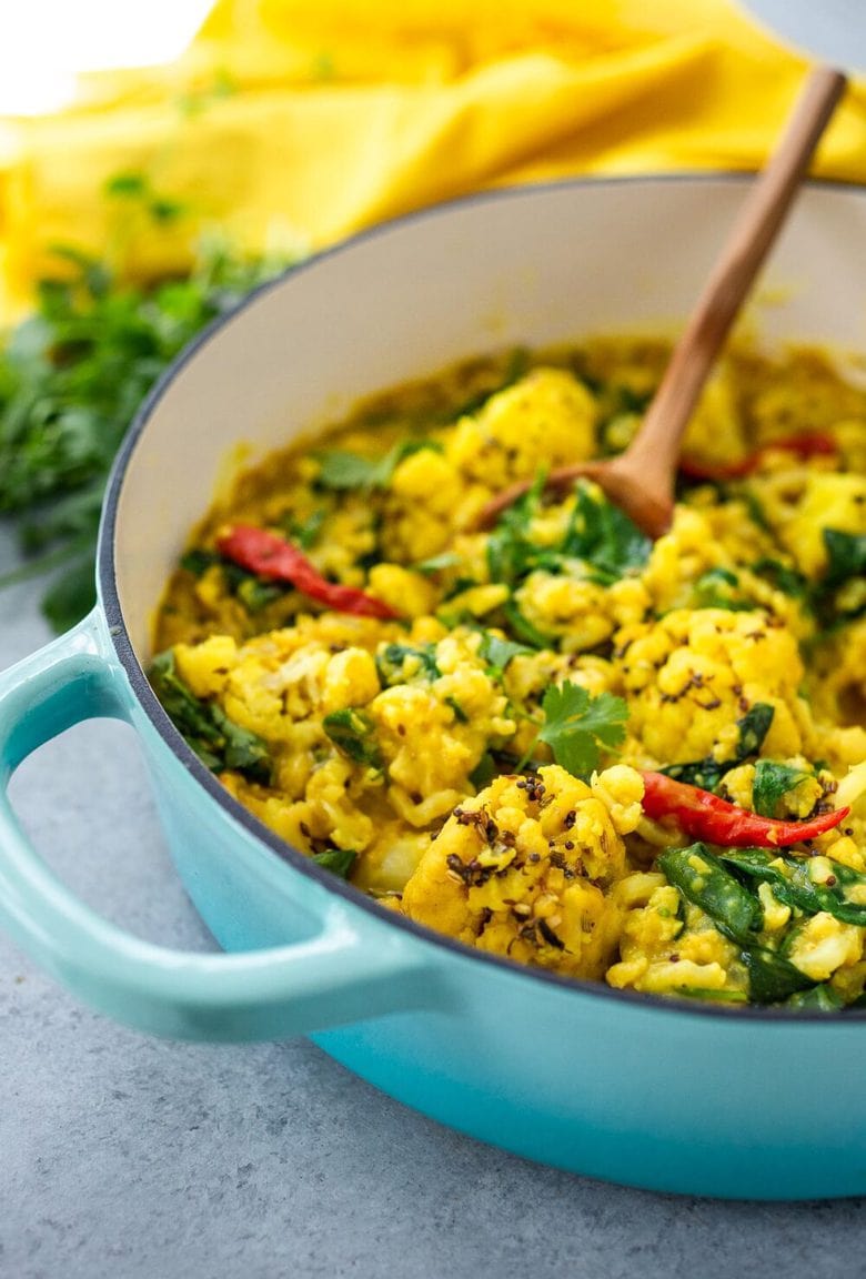 Cauliflower Dal with Coconut and Spinach made with split red lentils and fragrant Indian spices. A healthy comforting, plant-based dinner recipe. Vegan-adaptable. #dal #cauliflower #dalrecipe #lentils