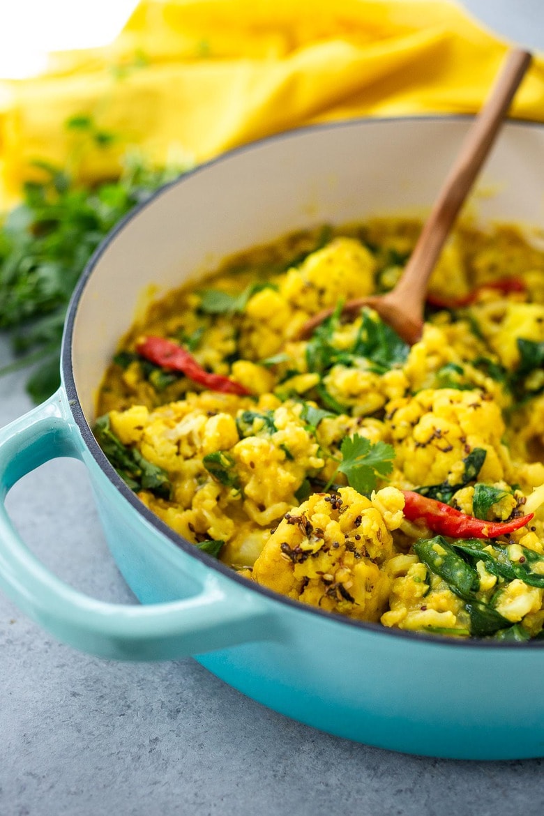 Cauliflower Dal with Coconut and Spinach made with split red lentils and fragrant Indian spices. A healthy comforting, plant-based dinner recipe. Vegan-adaptable. #dal #cauliflower #dalrecipe #lentils