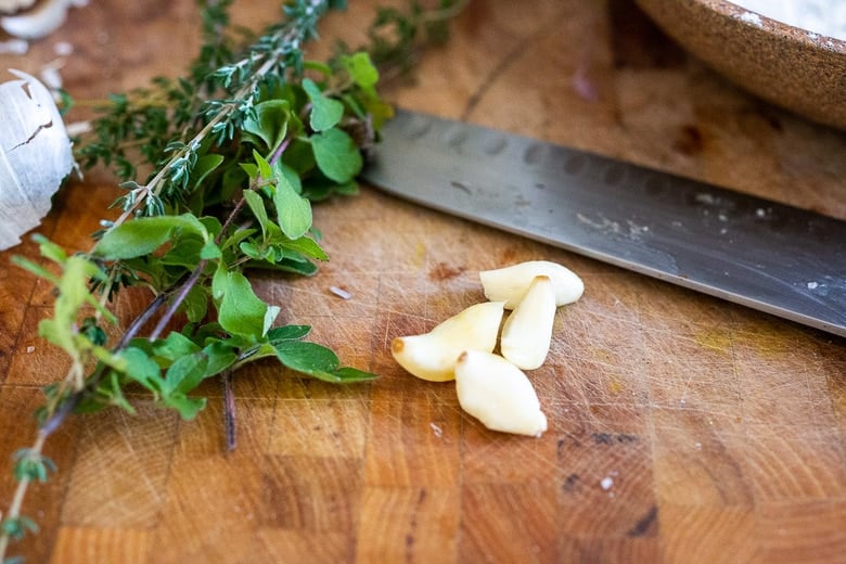 chopping herbs and garlic 