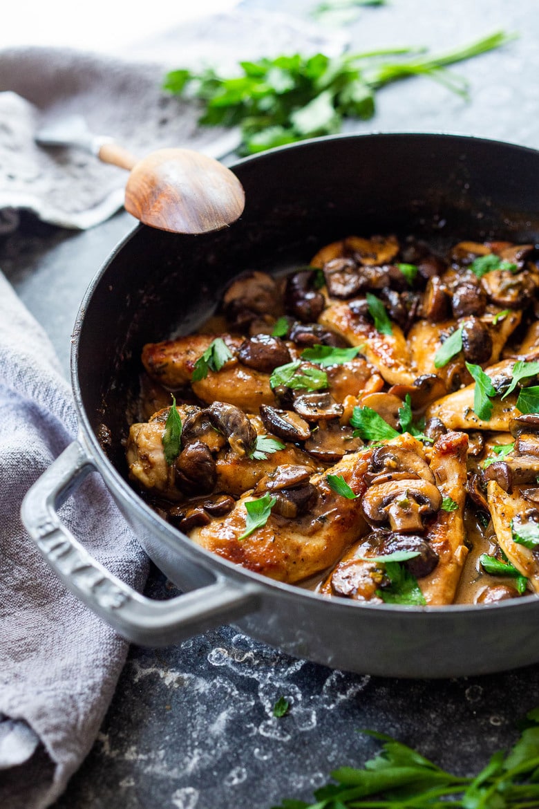 A classic recipe for Chicken Marsala- an Italian-inspired dinner served over creamy polenta. A delicious weeknight dinner idea! #chickenmarsala #chickenrecipes