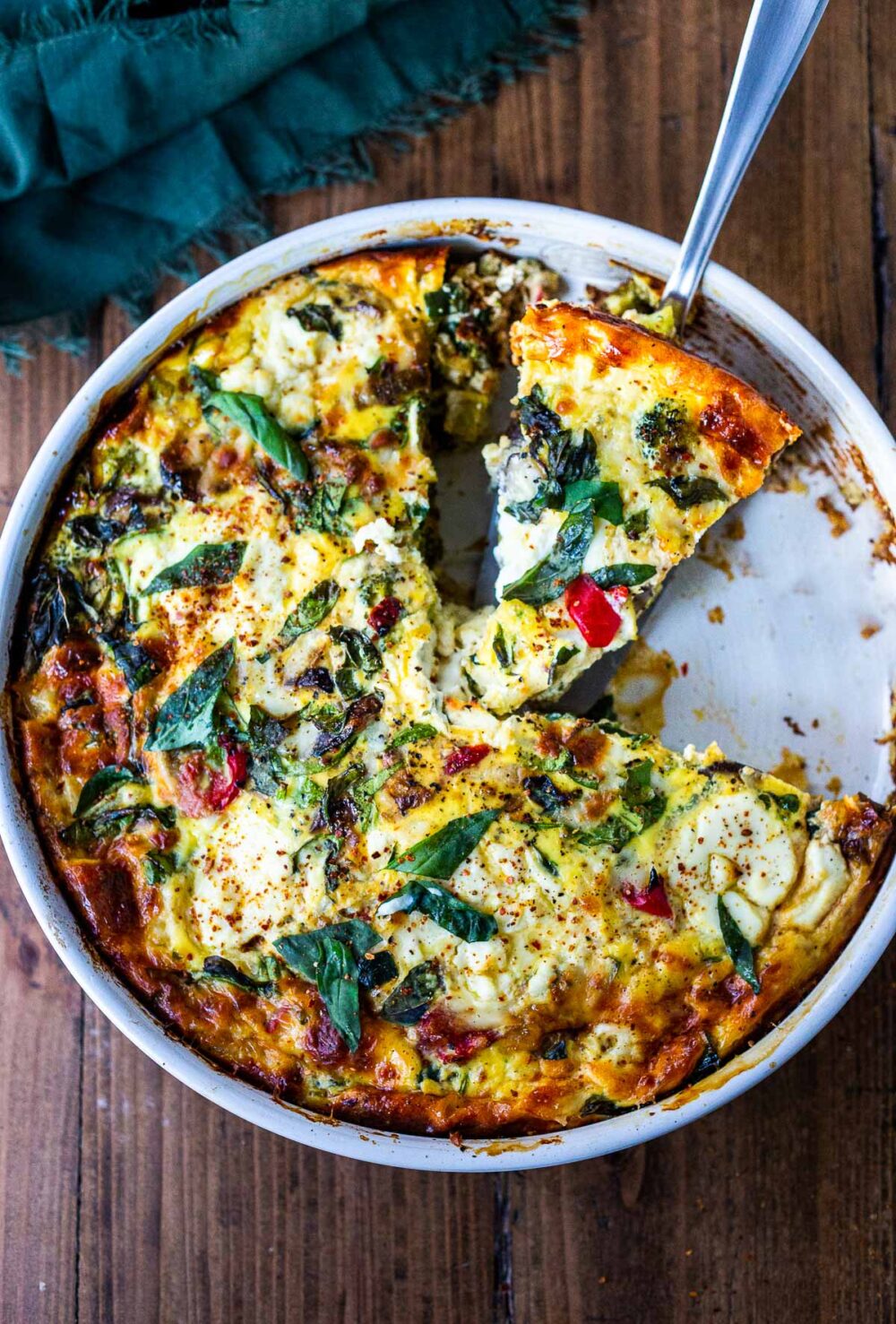 This delicious Frittata is full of healthy vegetables, baked in the oven, versatile and easy to make. Make it ahead for a special breakfast or brunch, or serve it up as a crustless quiche for lunch or dinner -a tasty clean-out-the fridge kind of meal. Vegetarian, Keto, Gluten-free and low-carb. #frittata #healthybreakfast #brunch #eggcasserole