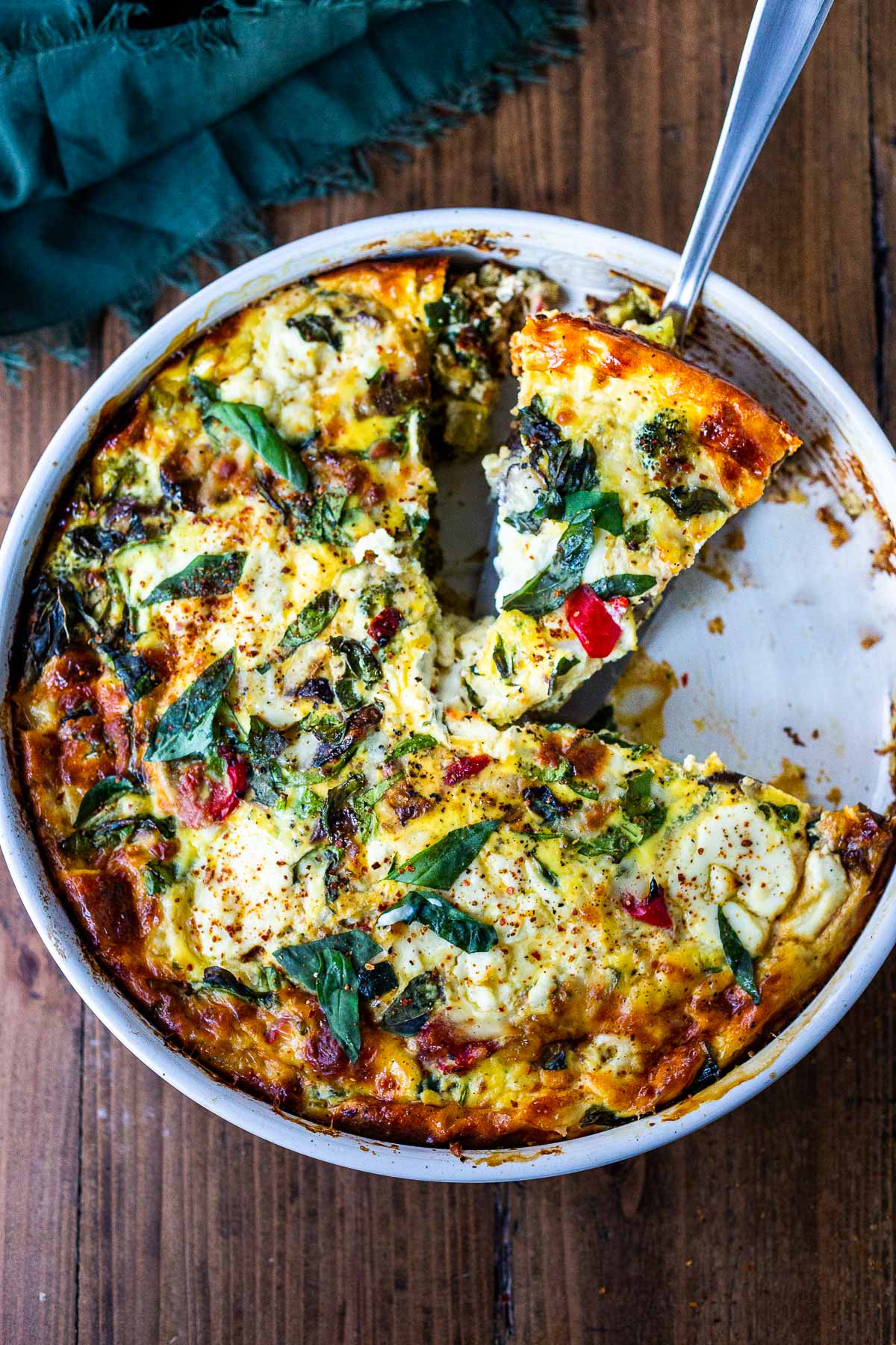 This delicious Frittata is baked in the oven and full of healthy vegetables. It's versatile, easy and can be made ahead - perfect for a speical breakfast or brunch. Or serve it up for lunch or dinner as a "crustless quiche" - a simple clean-out-the fridge kind of meal. Vegetarian, Keto, Gluten-free, and low-carb.