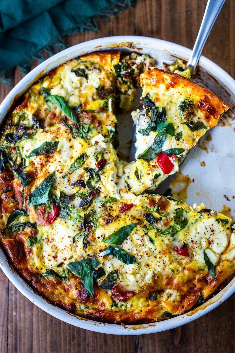 This delicious Frittata is full of healthy vegetables, baked in the oven, versatile and easy to make. Make it ahead, take it to your potluck and watch it disappear! Vegetarian, Keto, Gluten-free and low-carb. #frittata #healthybreakfast #brunch #eggcasserole