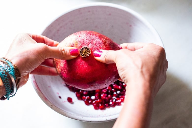 stretch and open the sides of the pomegranate