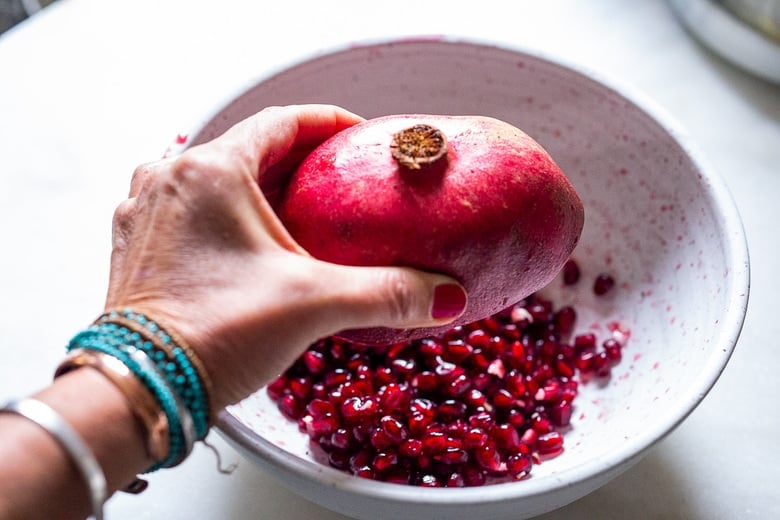 squeeze the pomegranate like an orange, gently and turning.