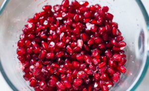 The EASIEST way to cut a pomegranate with a quick video tutorial. Once you try this method, for deseeding a pomegranate, you'll never go back! #pomegranate