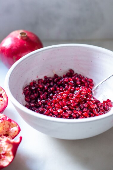 The EASIEST way to cut a pomegranate with a quick video tutorial. Once you try this method, for deseeding a pomegranate, you'll never go back! #pomegranate