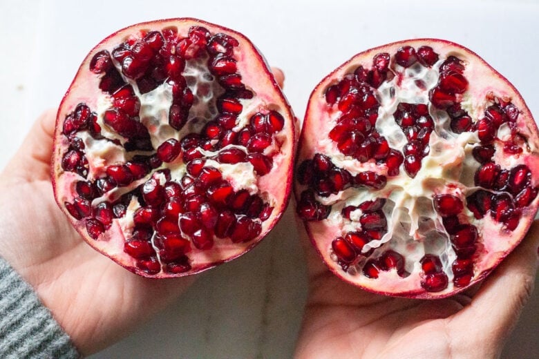 The EASIEST way to cut a pomegranate with a quick video tutorial. Once you try this method, for deseeding a pomegranate, you'll never go back! #pomegranate