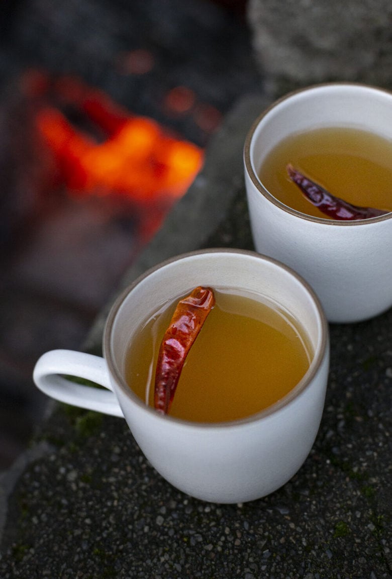 How to make a Hot Toddy at home, that we think is better than most of the professional versions you're likely to encounter! This recipe uses mezcal, lime juice & honey - but you can easily swap those out for the traditional whiskey with lemon - or nearly any other base spirit, citrus & spice combination that suits your tastes.  #hottoddy