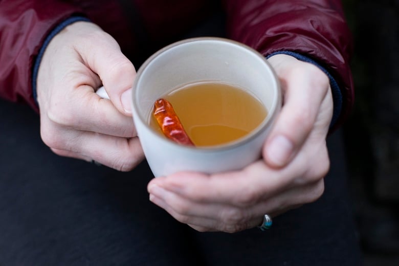 How to make a Hot Toddy at home, that we think is better than most of the professional versions you're likely to encounter! This recipe uses mezcal, lime juice & honey - but you can easily swap those out for the traditional whiskey with lemon - or nearly any other base spirit, citrus & spice combination that suits your tastes.  #hottoddy