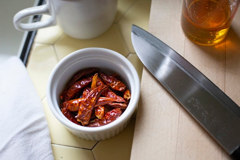 dried chilies in a rampkin