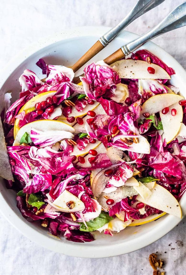 A simple, festive Radicchio Salad with Asian pears, walnuts, basil, shaved pecorino and pomegranate seeds in a simple vinaigrette dressing. Make ahead and toss before serving. #radicchio #radicchiosalad