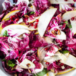 A simple, festive Radicchio Salad with fruit, nuts, and optional cheese in a delicious champagne vinaigrette.