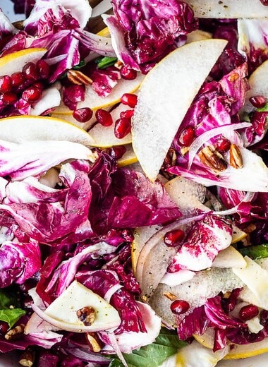 A simple, festive Radicchio Salad with fruit, nuts, and optional cheese in a delicious champagne vinaigrette. 
