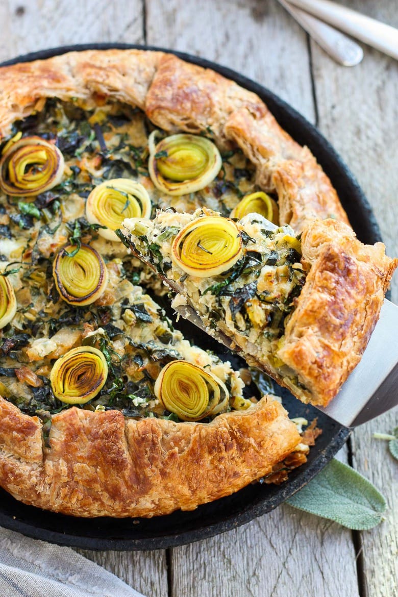 A Savory Galette filled with a luscious mixture of leeks, kale and mascarpone, enclosed in a free-formed, tender, extra flakey crust. #galette #savorygalette #tart #leeks 
